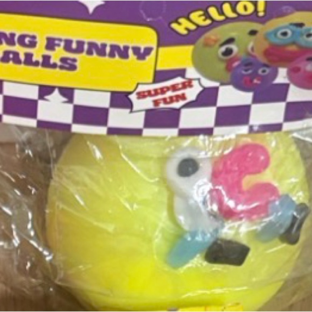 Yellow Squeezable Funny Face Ball Toy